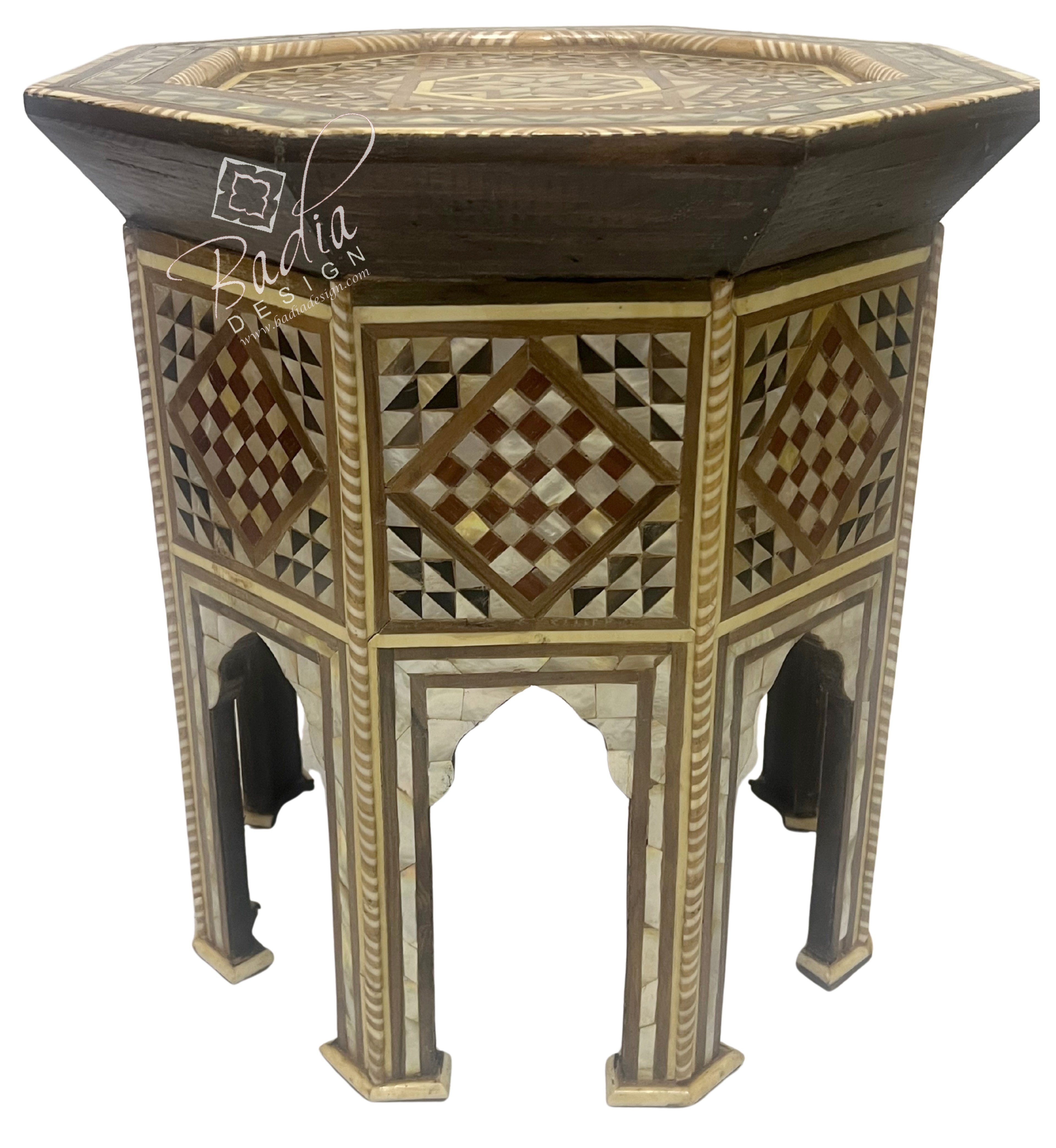 Decorative hexagonal side table with intricate patterns on a white background
