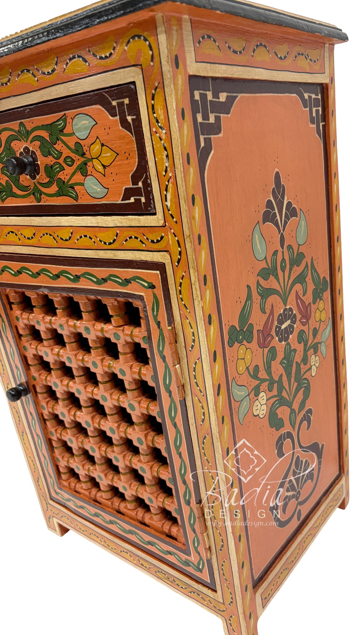 Decorative wooden cabinet with intricate carvings and floral patterns, featuring the brand &