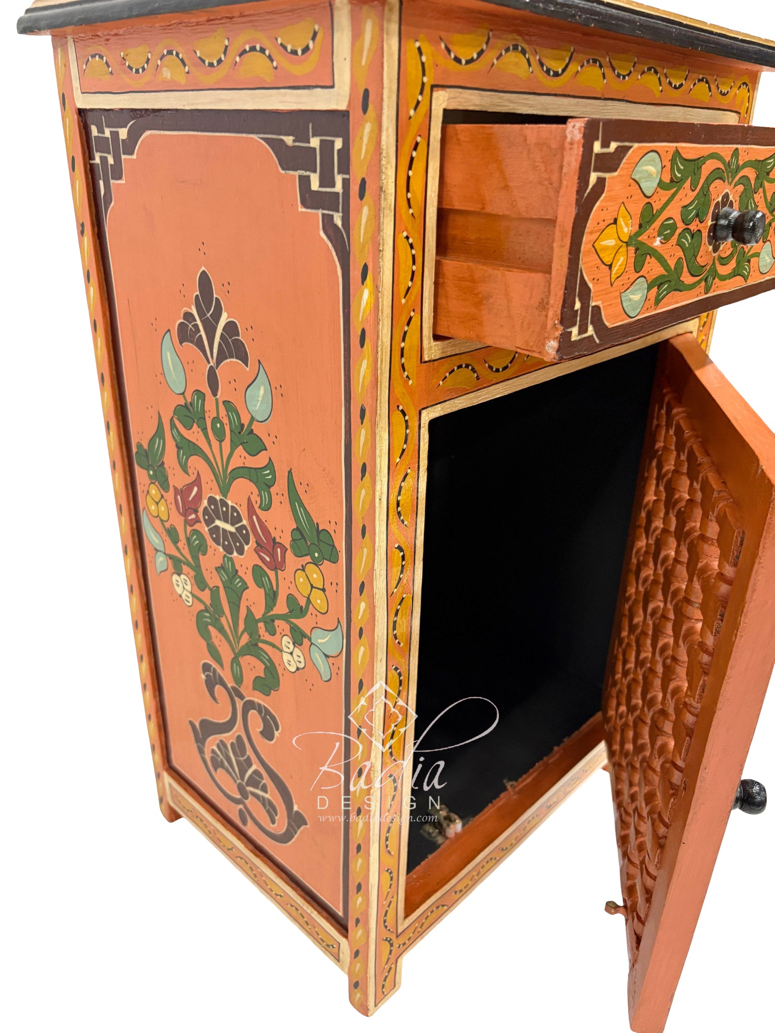 Decorative wooden cabinet with intricate carvings and open doors on a white background