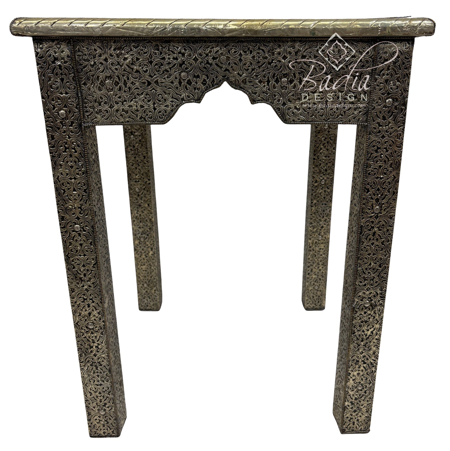 Decorative console table with intricate carvings on a white background, featuring the Badiia Design logo.