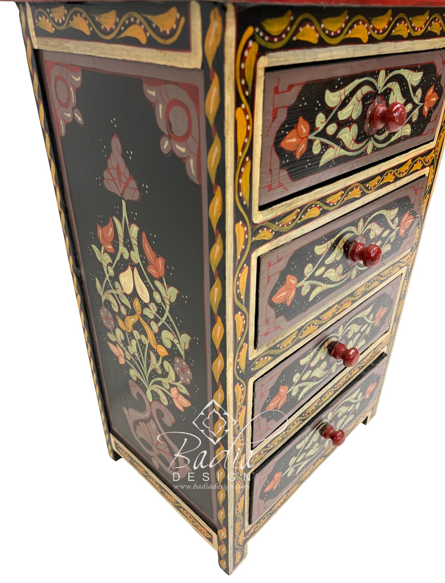 Decorative wooden cabinet with floral patterns and red knobs on a white background