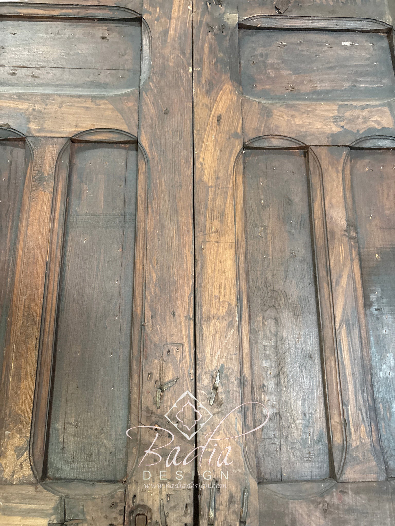 Handcrafted Wooden Door with Ornate Metal Accents