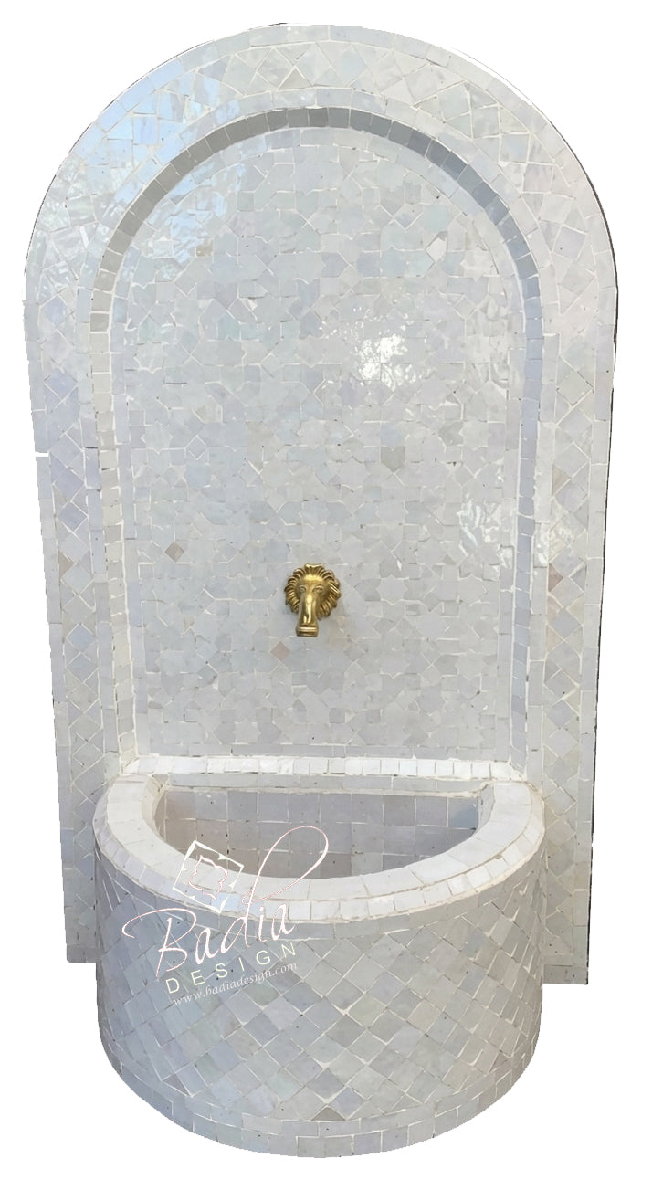 Decorative wall fountain with mosaic design on a white background