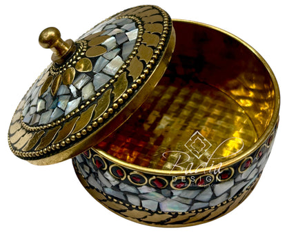 Decorative jewelry box with mosaic design and gold accents on a white background with open lid