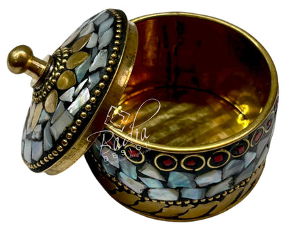 Decorative container with mosaic design and gold accents on a white background with open lid