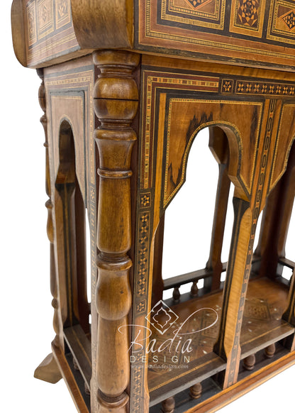 Wooden furniture with intricate inlay design on a white background