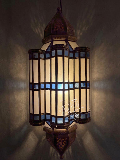 Decorative hanging lamp with intricate design on a dark background