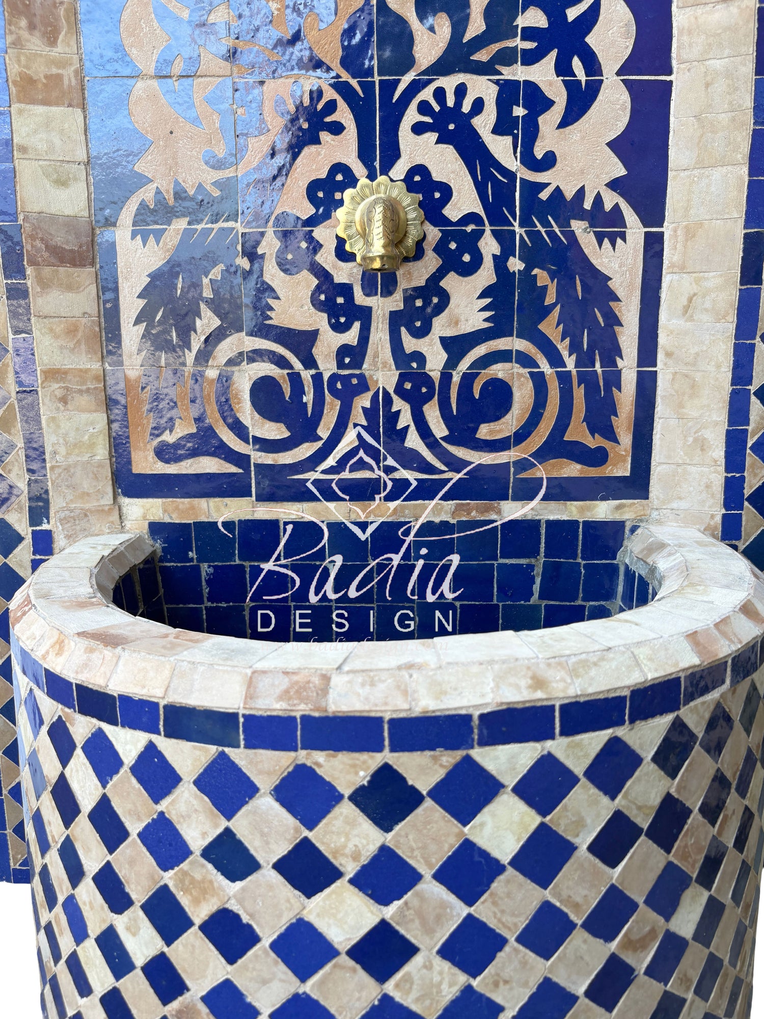 Decorative tiled fountain with intricate patterns and &