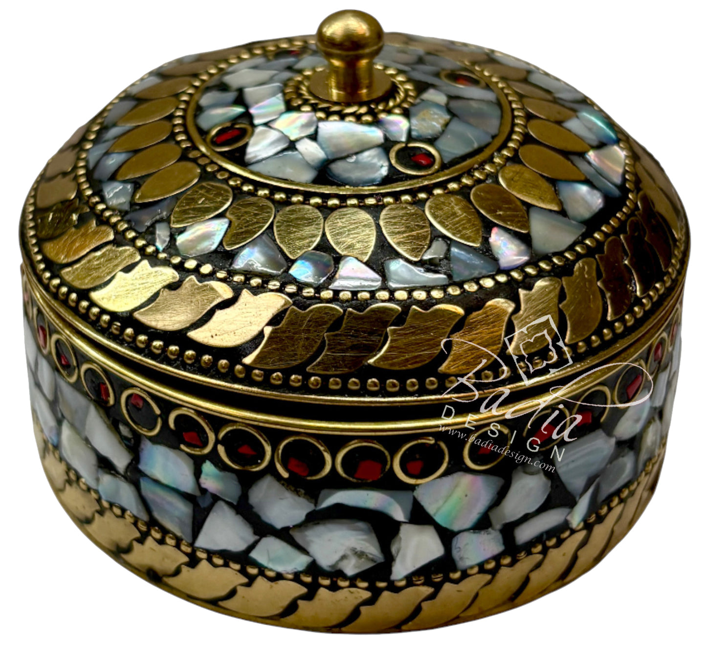 Decorative round box with gold and gemstone details on a white background