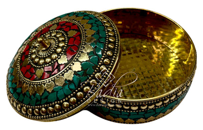 Decorative box with intricate designs with open lid.