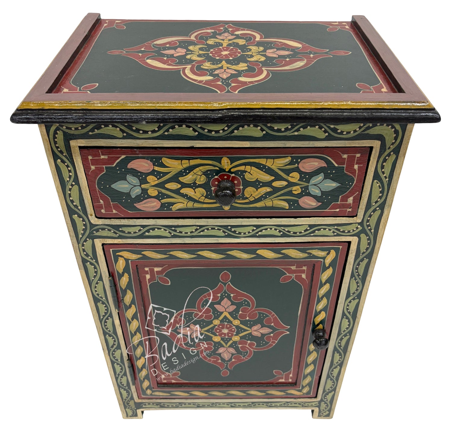 Decorative wooden side table with intricate floral patterns on a white background