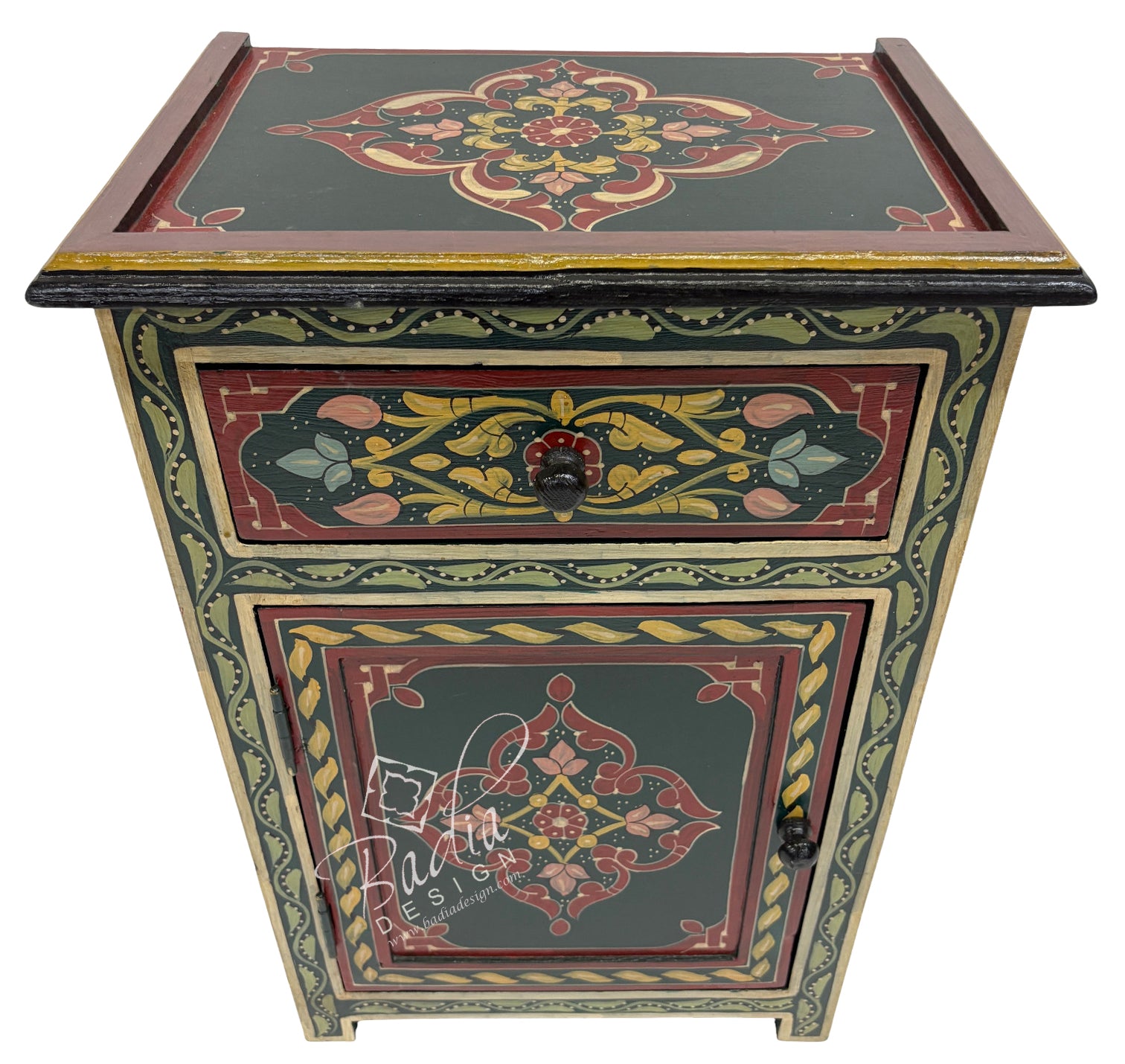 Decorative wooden side table with intricate floral patterns on a white background