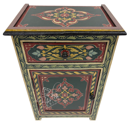 Decorative wooden side table with intricate floral patterns on a white background