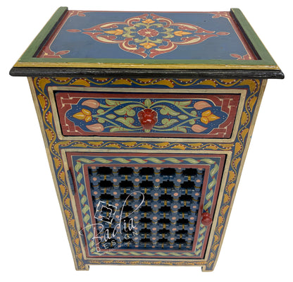 Decorative wooden side table with intricate patterns on a white background