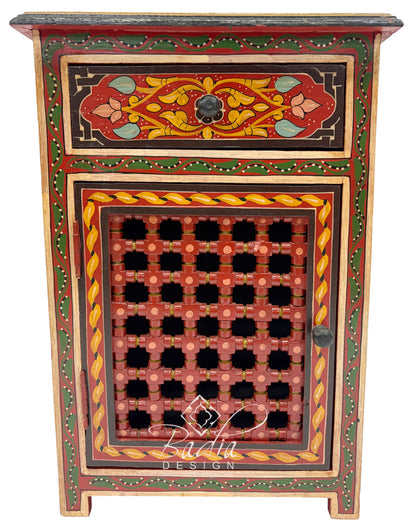 Decorative wooden cabinet with intricate patterns and colors on a white background