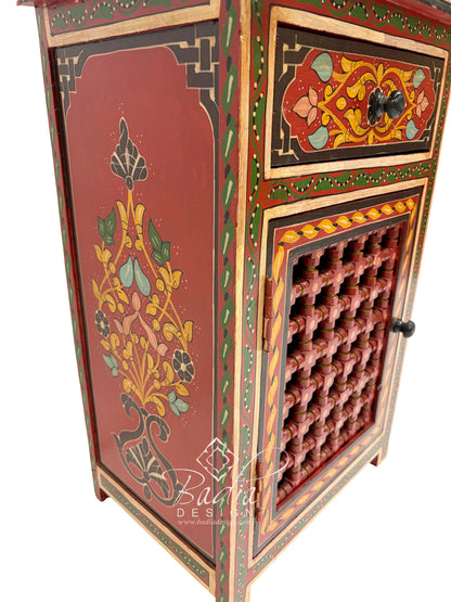 Decorative wooden cabinet with intricate designs and a butterfly emblem on a white background.
