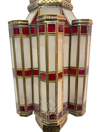 Decorative lamp with red and gold accents on a white background