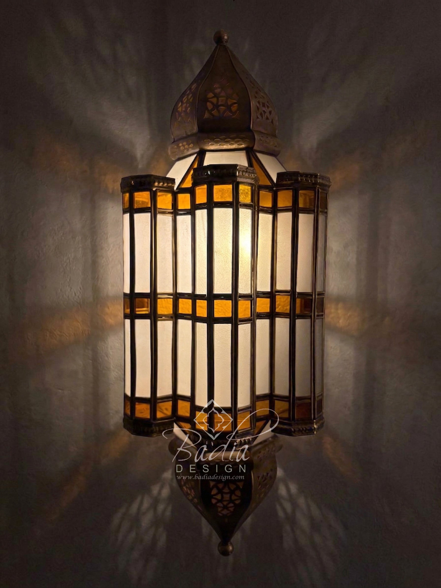 Decorative wall lamp with stained glass design on a dark background