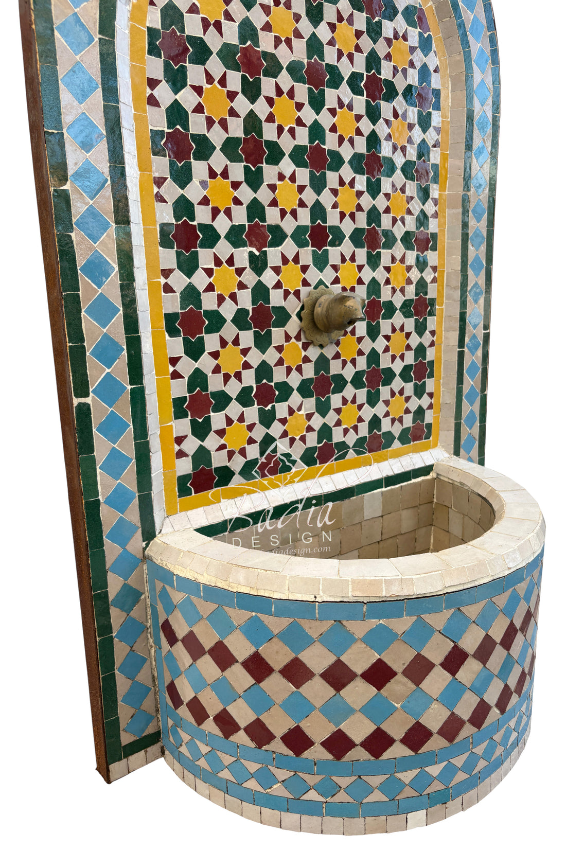 Decorative mosaic water fountain with geometric patterns on a white background
