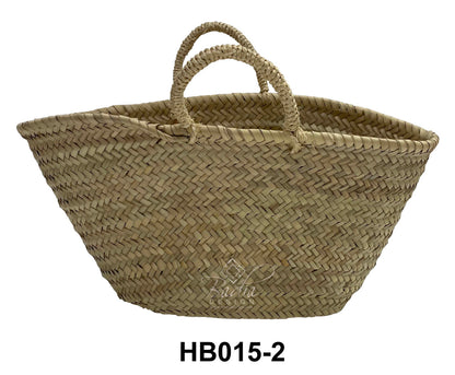 Woven basket with handles on a white background, featuring the brand &