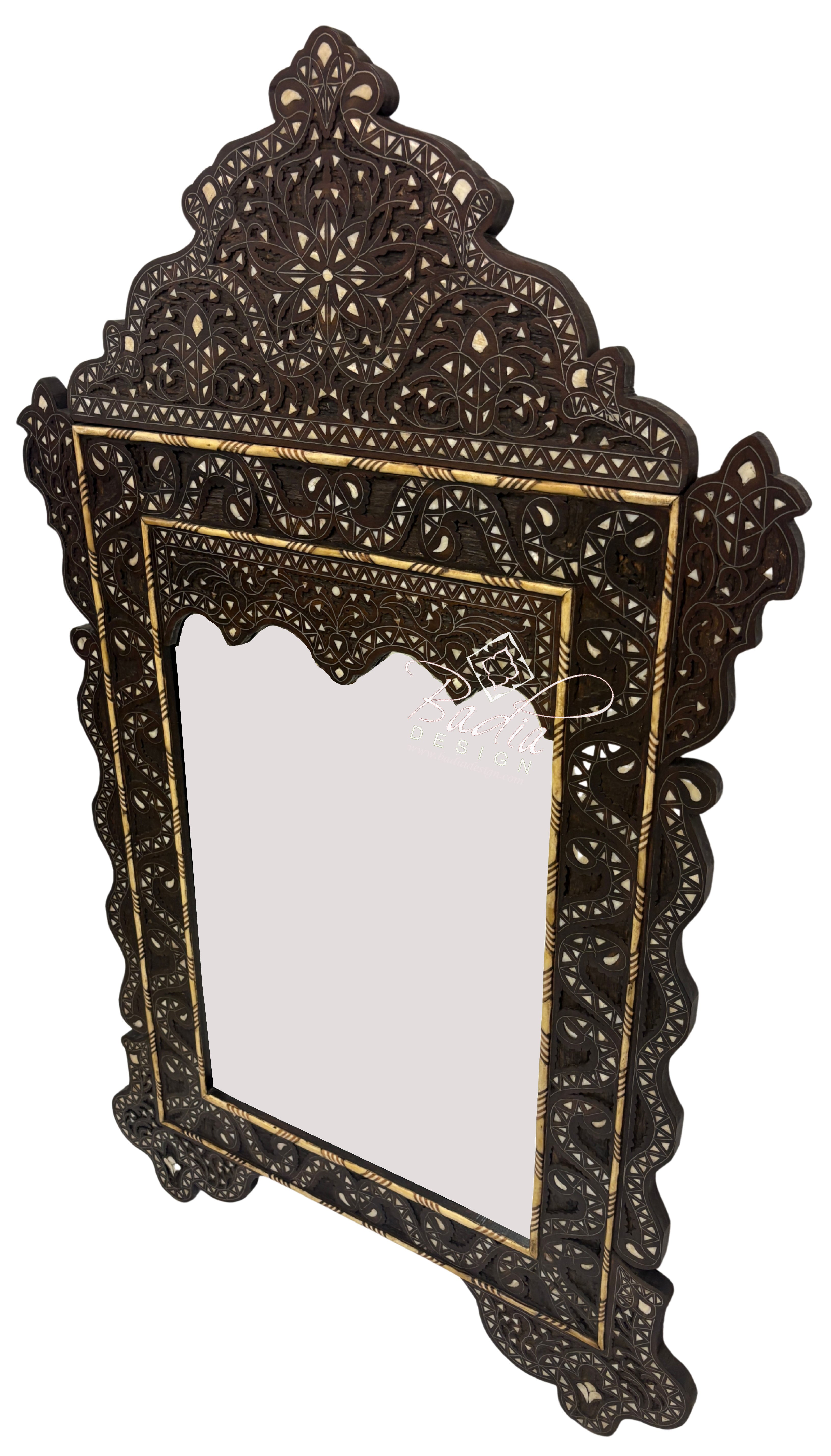 Decorative mirror with intricate dark brown frame on a white background