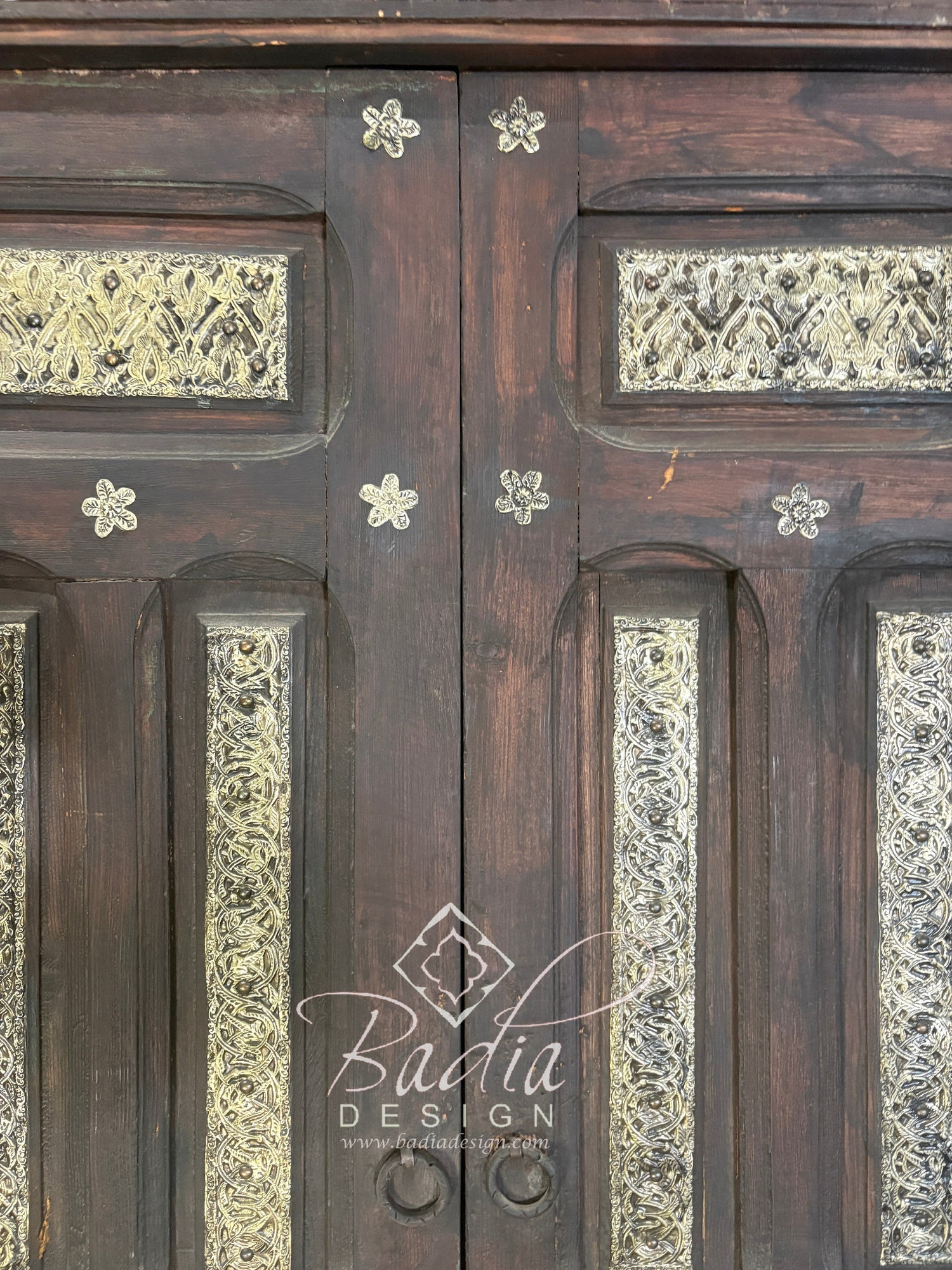 Handcrafted Wooden Door with Ornate Metal Accents
