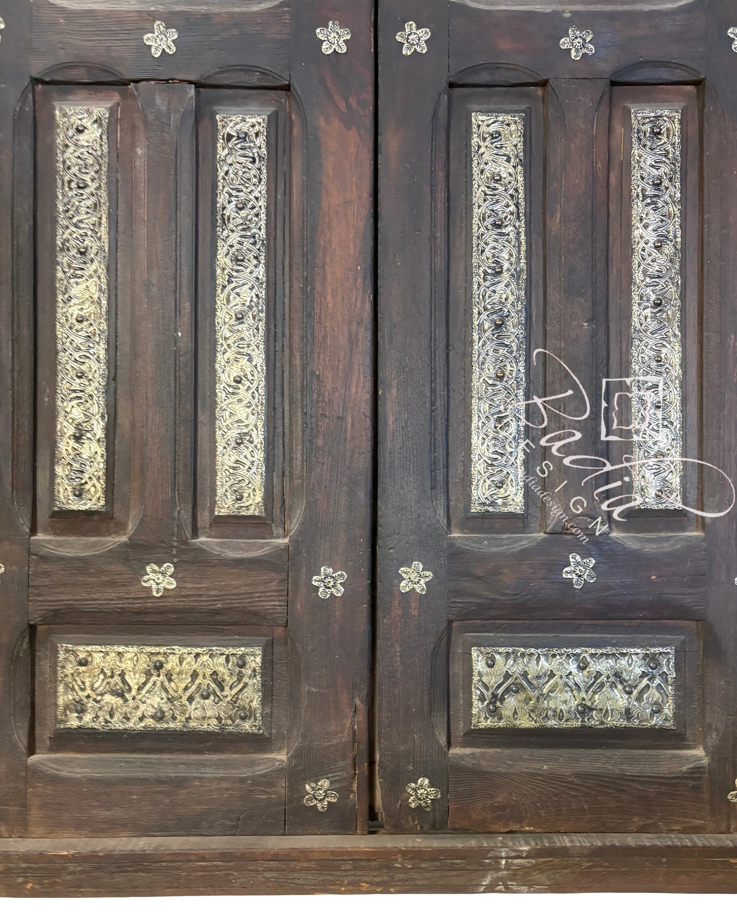Handcrafted Wooden Door with Ornate Metal Accents