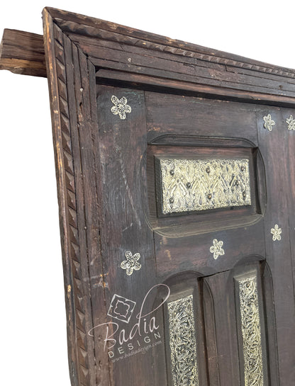Handcrafted Wooden Door with Ornate Metal Accents
