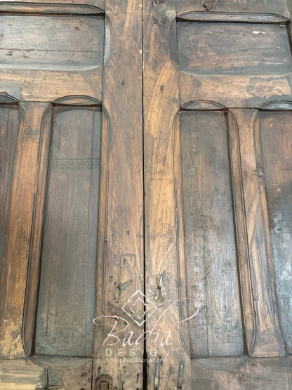 Handcrafted Wooden Door with Ornate Metal Accents