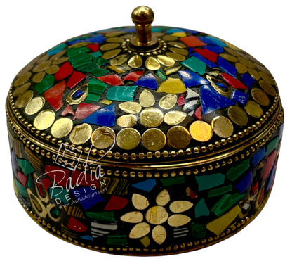Decorative box with mosaic design and gold accents, featuring the Badia Design logo.