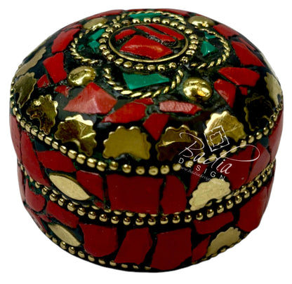 Decorative box with mosaic design featuring red, green, and gold colors on a white background.