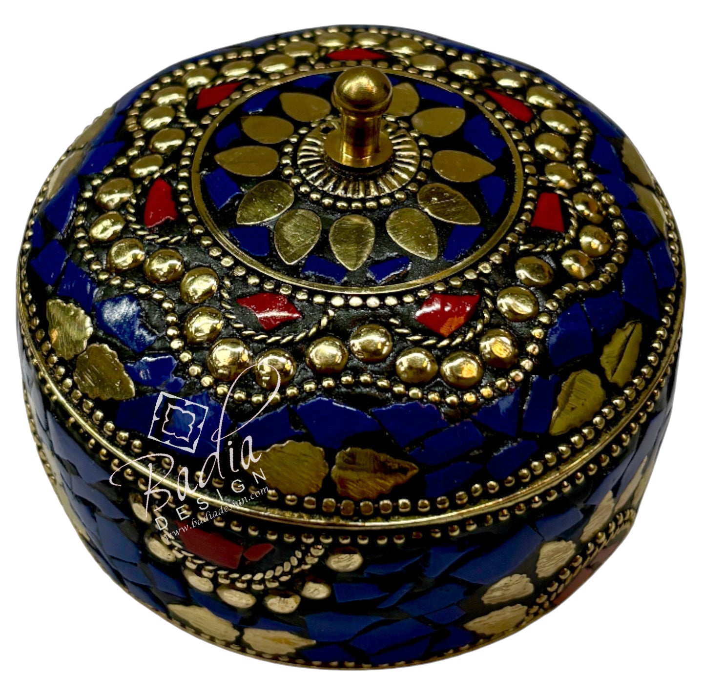Decorative round box with intricate patterns on a white background