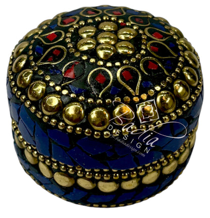 Decorative box with intricate gold, blue, and red patterns on a white background