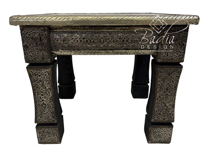 Decorative table with intricate carvings and &