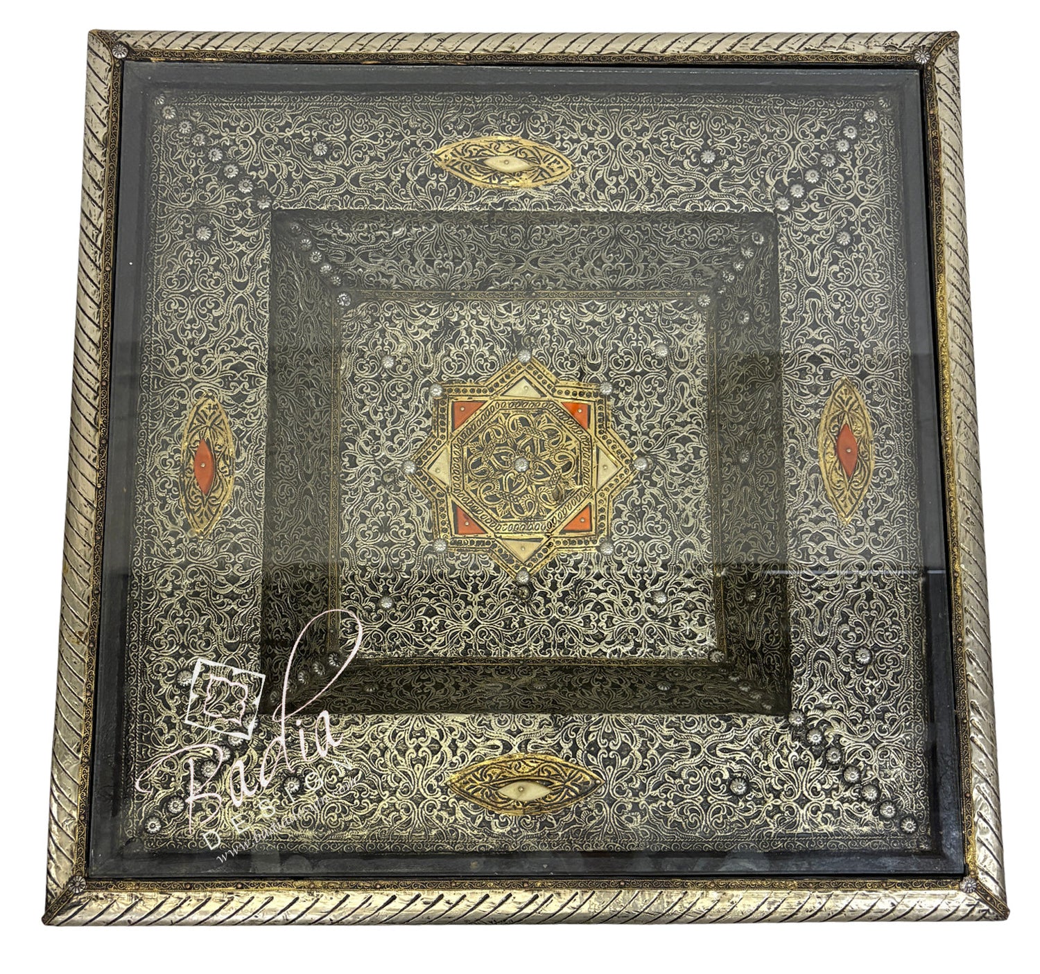 Decorative brass table top with intricate patterns and designs