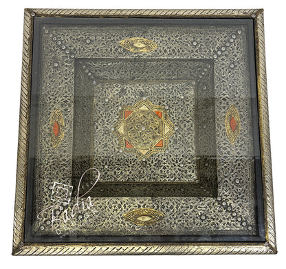 Decorative brass table top with intricate patterns and designs